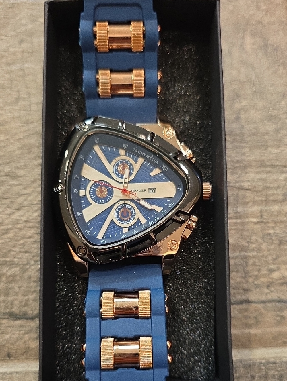 61. Blue Triangular Sport Watch with Rose Gold Accents